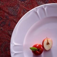 Minimalist dish with apple garnish