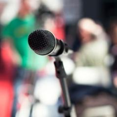 microphone in front of large crowd