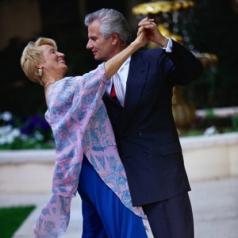 mature couple dancing outside