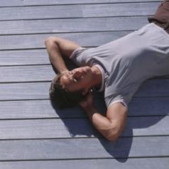 man lying on deck