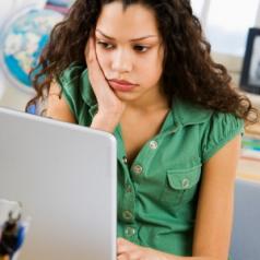 teen girl using laptop