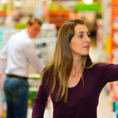 Man turns to look at woman in grocery store