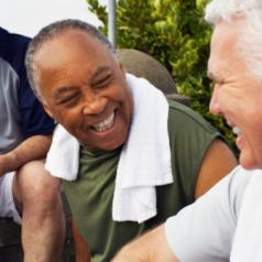 Senior men laugh after a workout