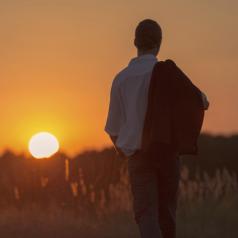 Man walking at sunset 