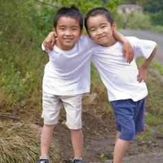 Two little boys standing together