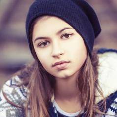  teenage girl in hat outdoors