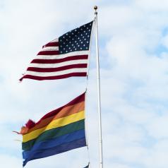 A flagpole displaying an American flag and an LGBT equality flag