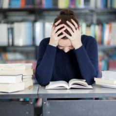 Female student overwhelmed with homework