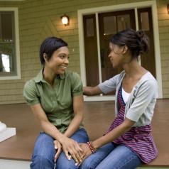 Women talking on front porch