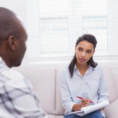 African American man in therapy session with African American therapist