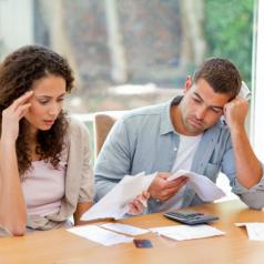 A Young couple calculates their finances together