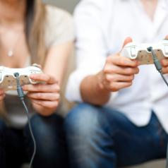 A man and a woman playing video games