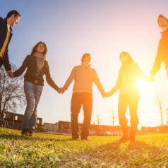 Multiracial Young People Holding Hands in a Circle