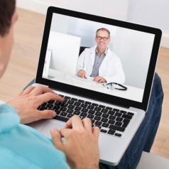 Man talking to therapist over video chat