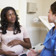 Pregnant woman meeting with a nurse