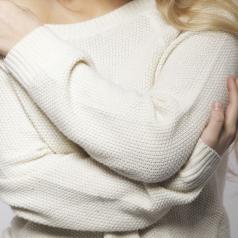 Cute blonde model in oversized sweater