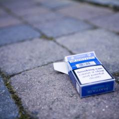 Discarded cigarette pack lying on ground