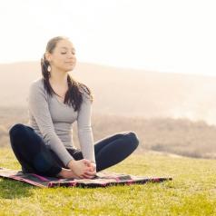 young-woman-meditation-pose-hill