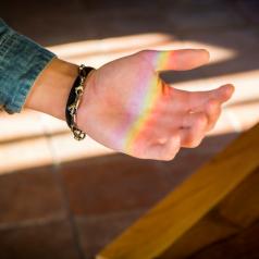 rainbow light on palm of hand
