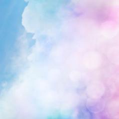 An abstract cloudscape with pink bokeh effects.