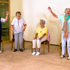 Elderly women standing and sitting for exercise
