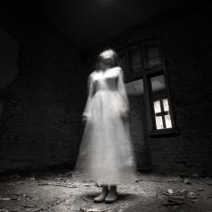 ghostly figure in white dress
