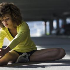 Woman stretching before beginning exercise