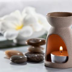 Aromatherapy candle and frangipani flower