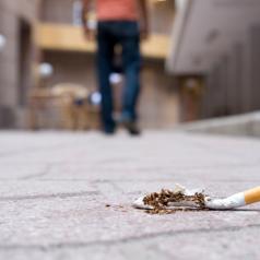 figure walking away from cigarette