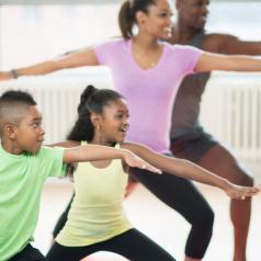 Parents and kids do yoga together