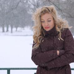 Woman standing outside in snow