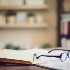 glasses and books in empty study