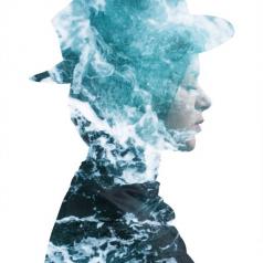 Double exposure of person wearing hat with calm face and eyes closed, turbulent sea