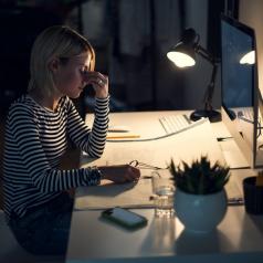 Stressed woman working at night