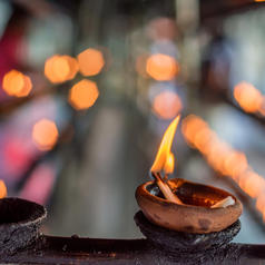 Coconut oil lit in temple