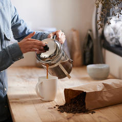 Person pouring coffee from french press