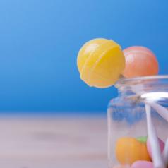 Close-up of lollipops in a jar.