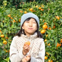 Savoring the taste of an orange outside