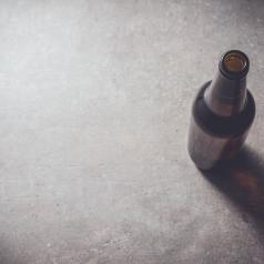 Beer bottle on dark table
